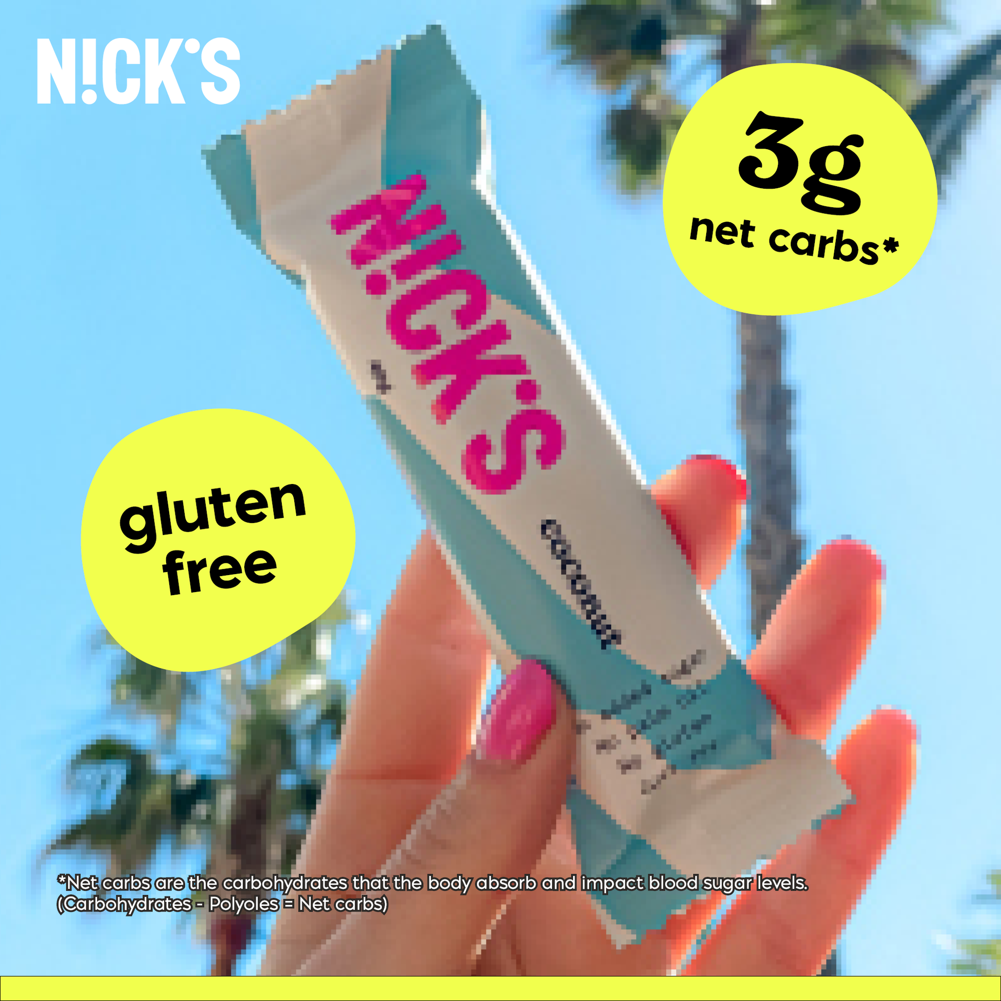 Two N!CK'S Coconut Candy Bars, one partially unwrapped, sitting on a tropical-looking surface with coconut pieces.