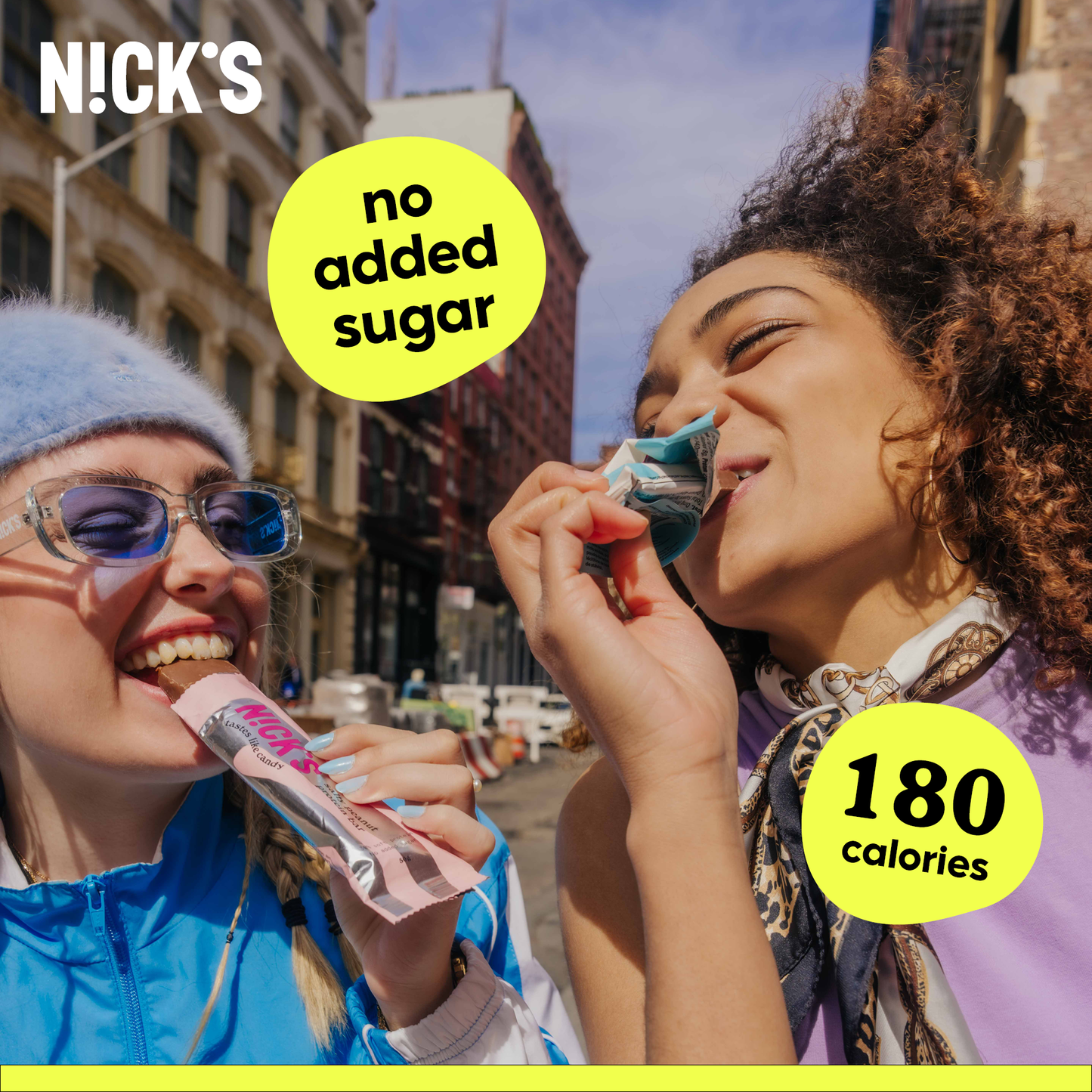 An unwrapped N!CK'S Peanuts & Fudge Candy Bar next to its wrapper, highlighting the peanut and caramel layers.