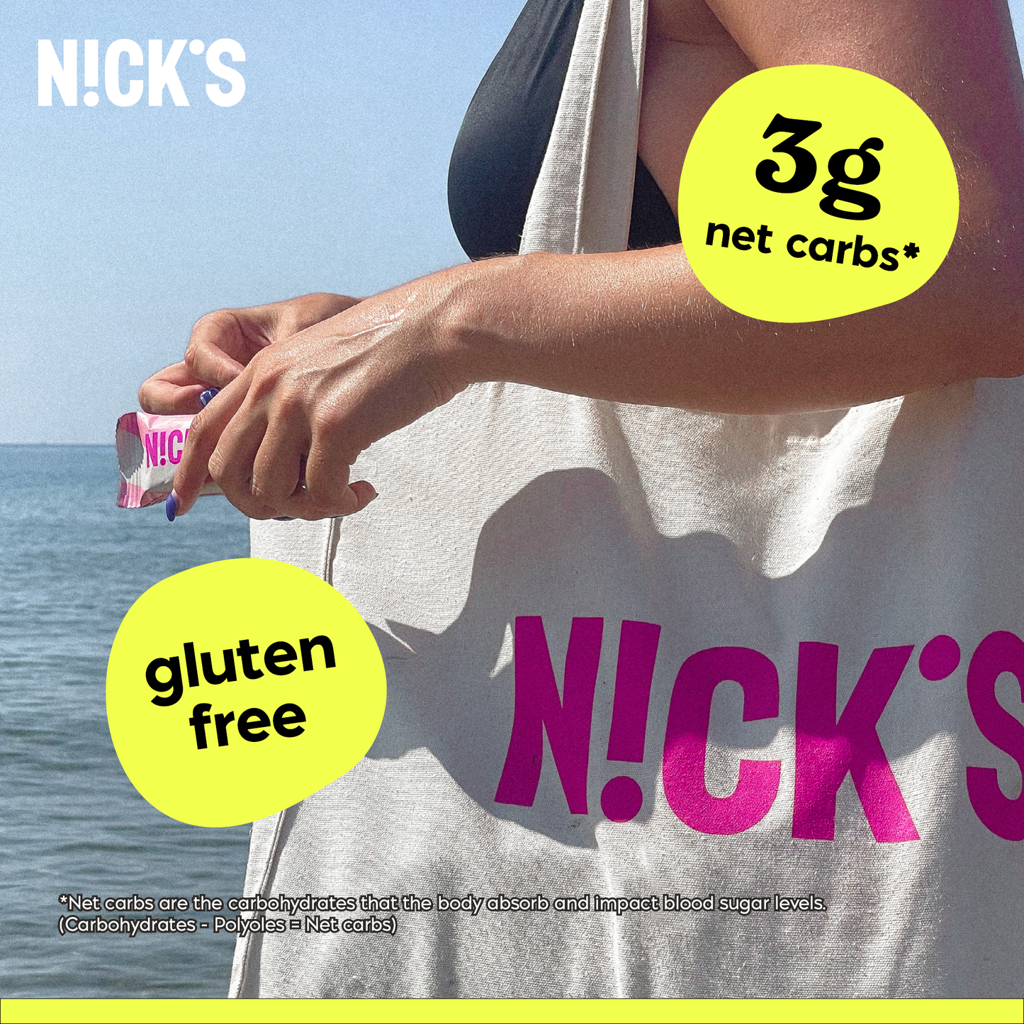 Two N!CK'S Peanuts & Fudge Candy Bars, one partially unwrapped, sitting next to whole peanuts.